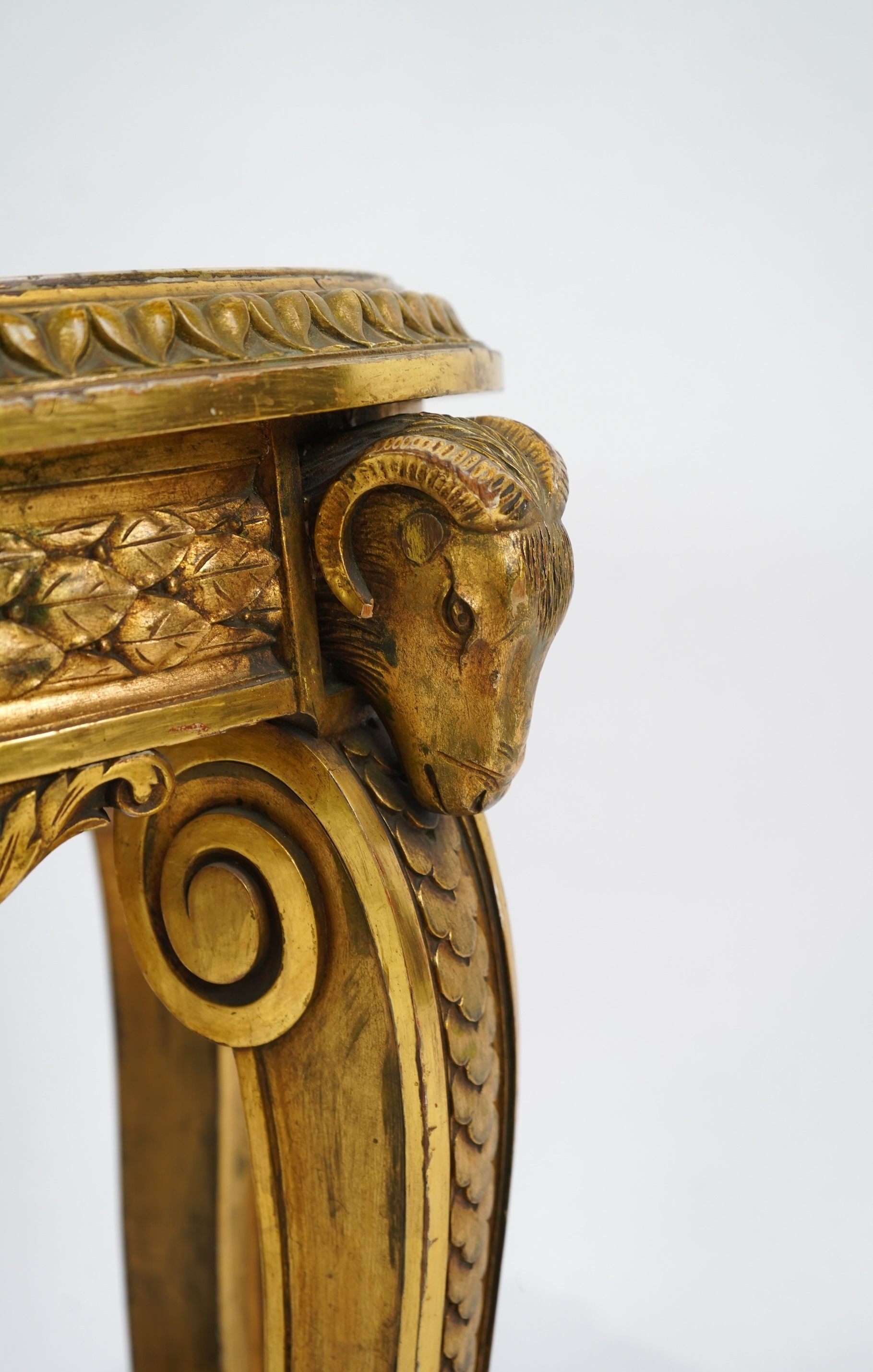 A late 19th century French circular carved giltwood and composition vase stand